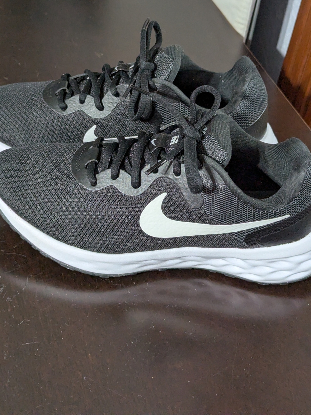 Nike Black Running Sneakers with White Swoosh